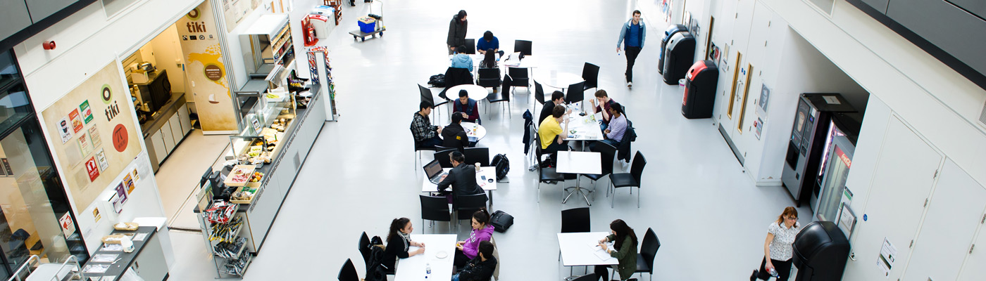 Aerial view of people sat in Alan Turing Building foyer
