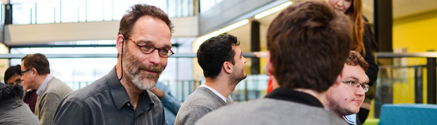 Professor in discussion with student in Alan Turing Building