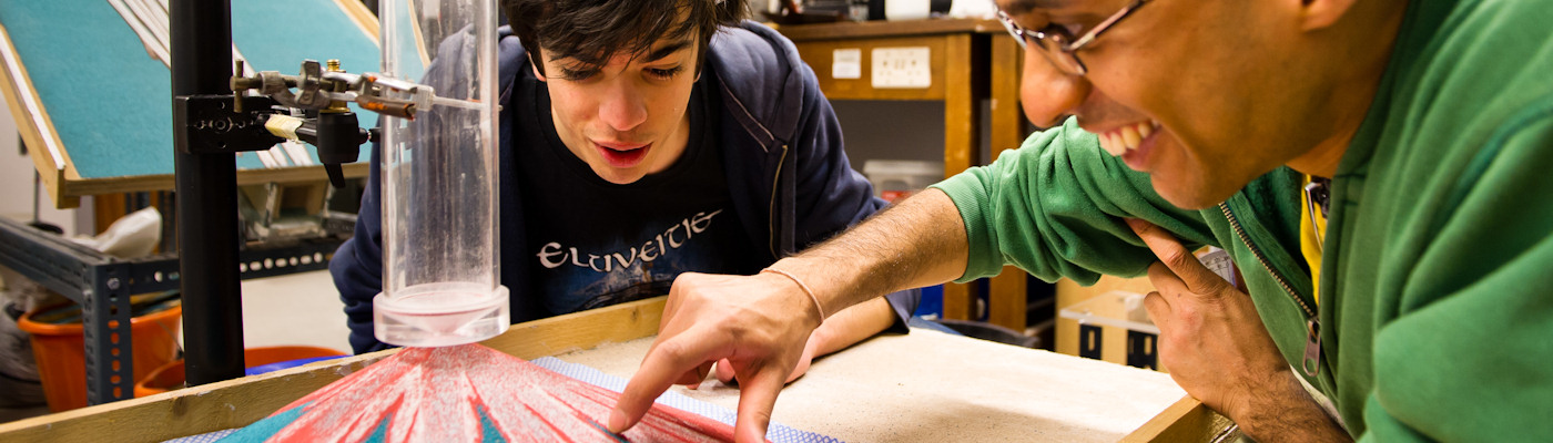 Two students with model of volcano