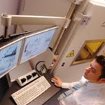 Researcher using a couple of lab computers