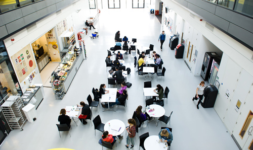 Aerial view of people sat in Alan Turing Building foyer