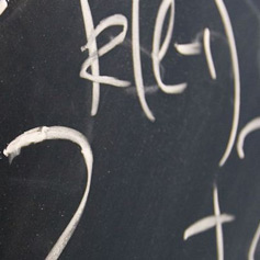 Close-up of algebraic equation on blackboard