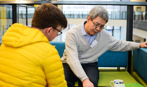 Academic talking to student