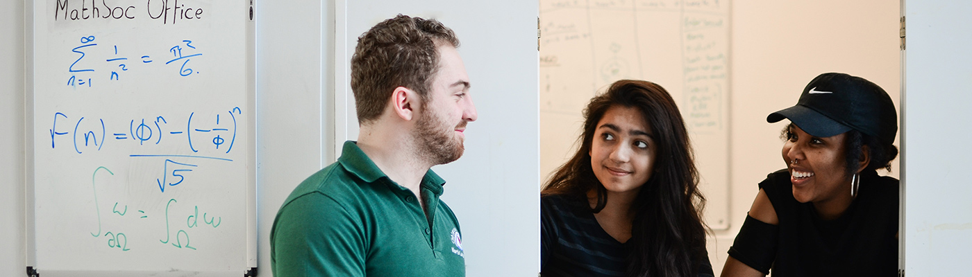 Students in discussion through an open slide window